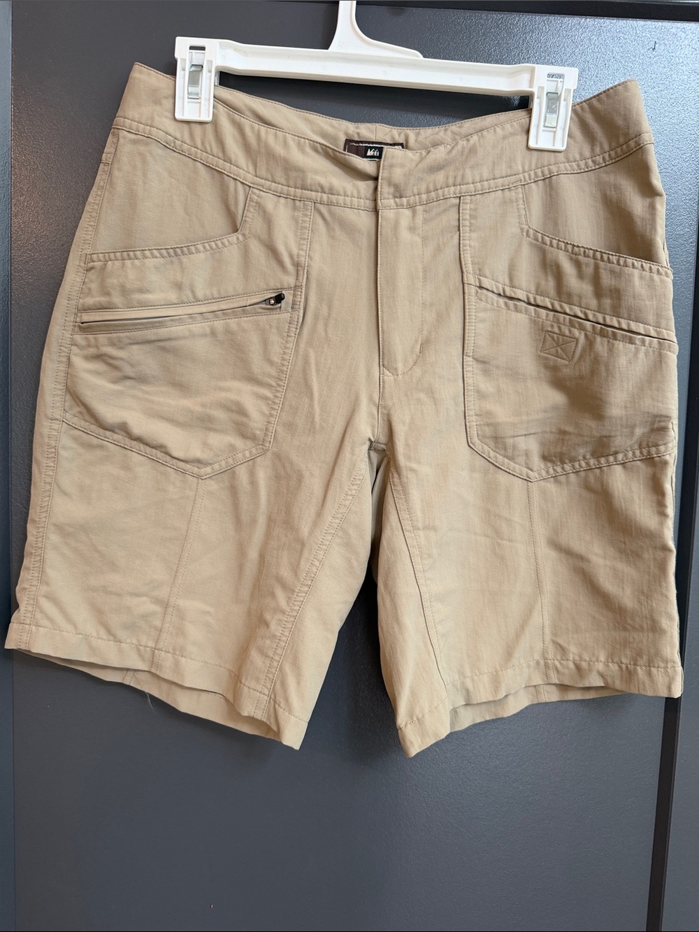 REI women’s Tan Cargo Shorts with Zip Pocket. Size 10